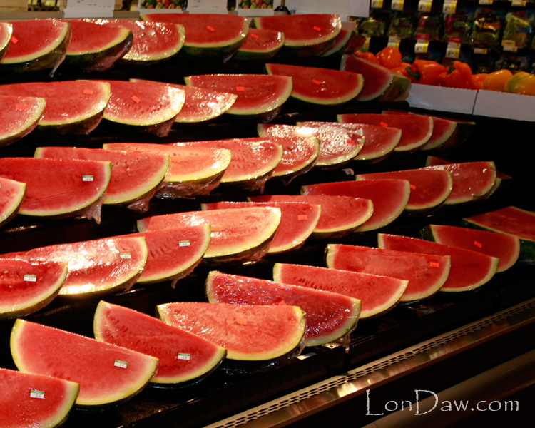 Cut watermelon on display in grocery story