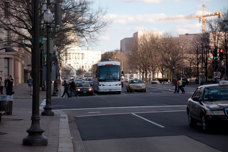 traffic on penn ave with capitol in background
