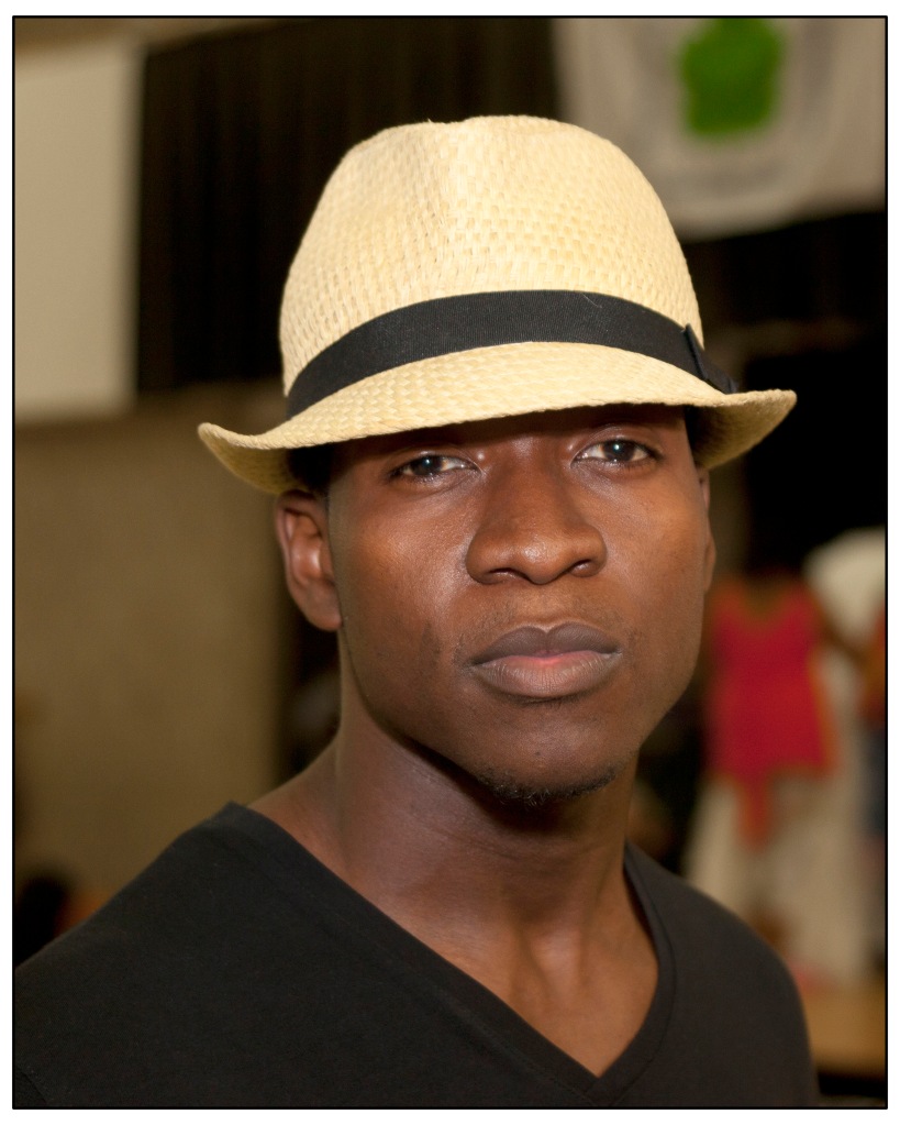 Handsome black male wearing straw hat